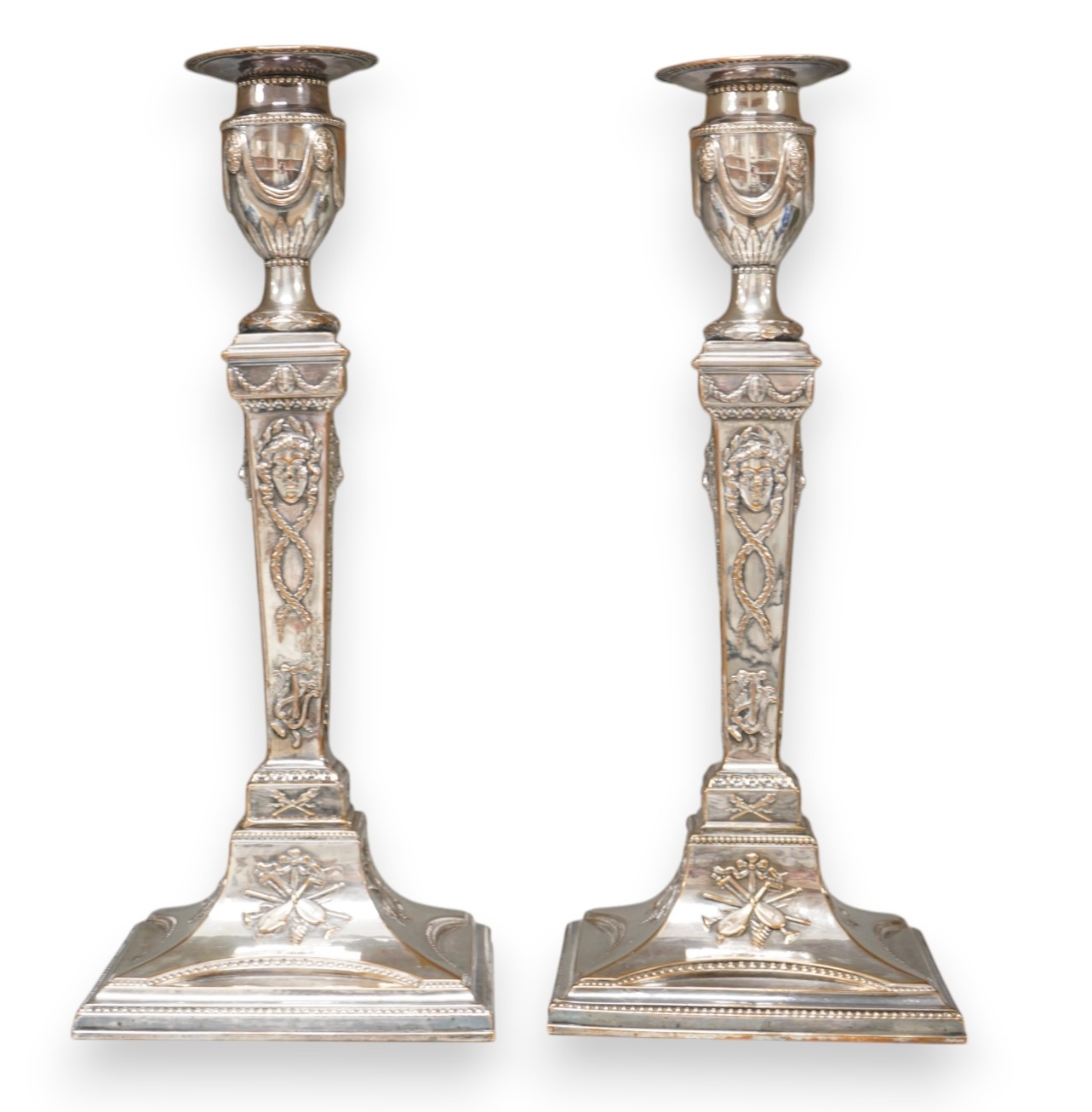 A pair of Adam design silver plated candlesticks, 29cm. Condition - worn